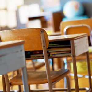 Classroom with empty wooden desks