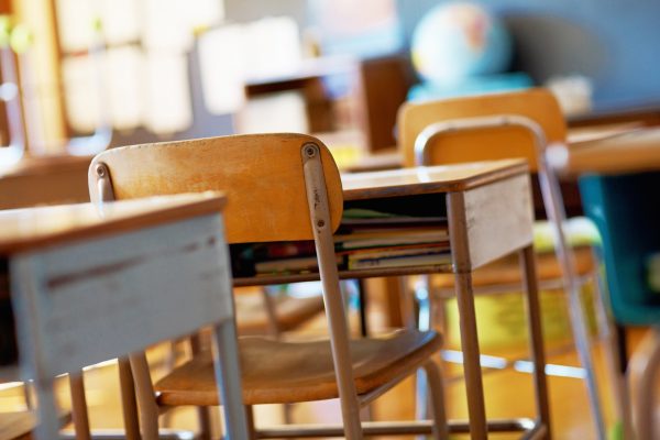 Classroom with empty wooden desks