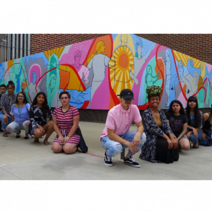 SJTA members posing in front of art