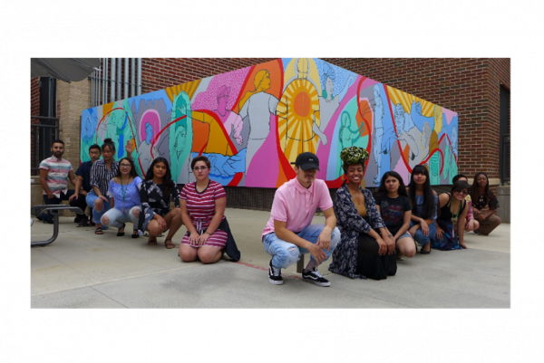 SJTA members posing in front of art